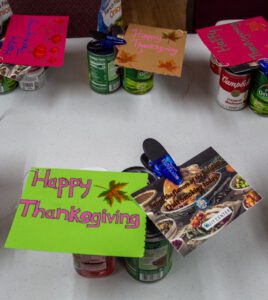 Donated food items along with a Thanksgiving card put together by a Coastal Prep student to be handed out at local food bank.